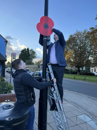 Paul putting poppies up 
